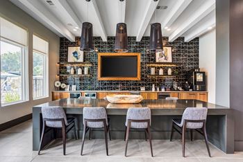 Clubhouse including business center and sporting room featuring shuffleboard and billiards